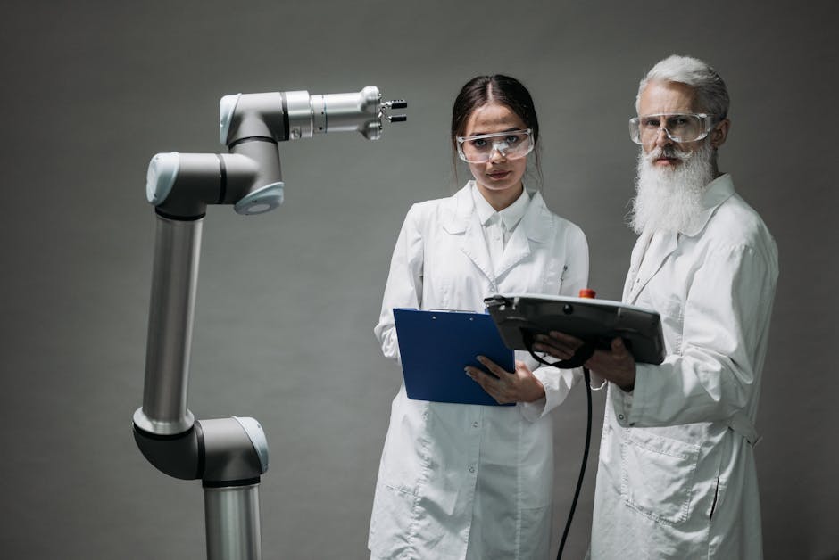 Two scientists in lab coats analyzing a robotic arm in a laboratory setting