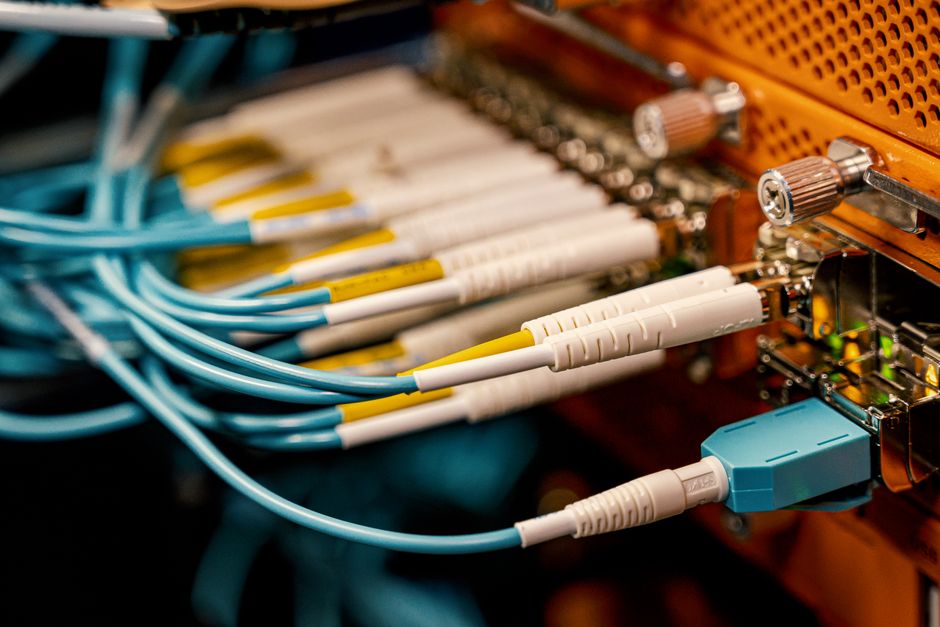 From above of optical switch equipment with many similar connectors