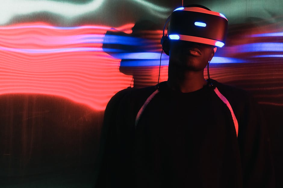 A person wearing virtual reality headset surrounded by colorful neon lights
